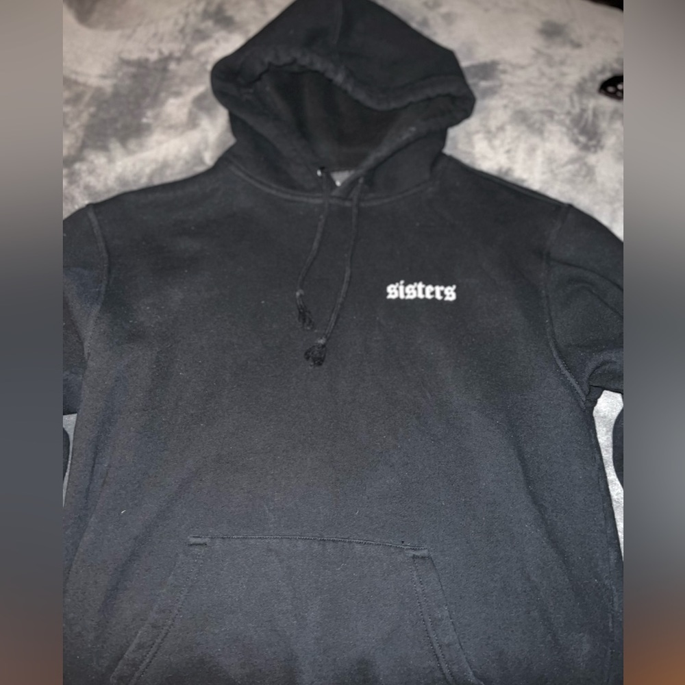 James Charles black Sisters hoodie.